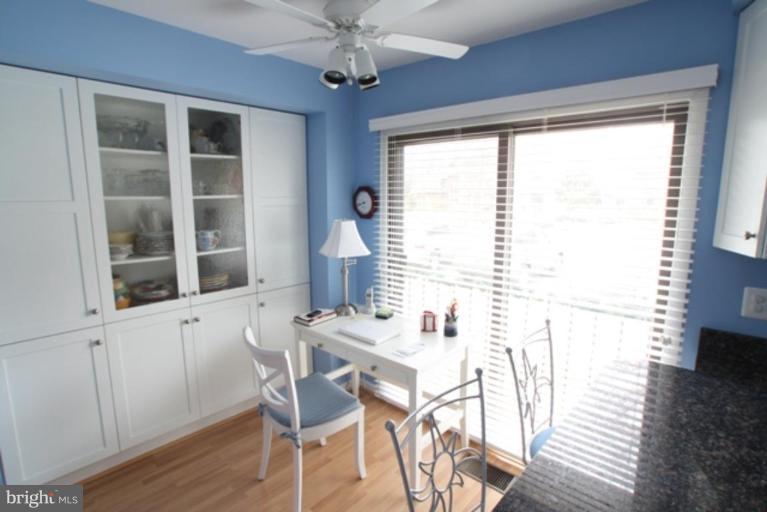 8111 Inverness Ridge Road Potomac, MD 20854 - Photo 7 of 17 a view of a dining room with furniture window and wooden floor