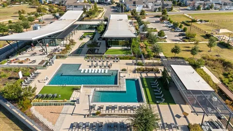 an aerial view of residential building and ocean