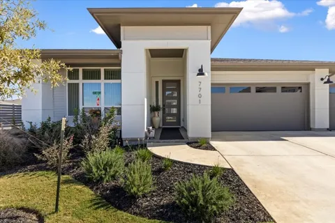 a front view of a house with yard