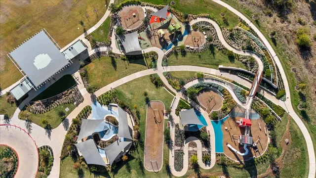 an aerial view of a house with a swimming pool