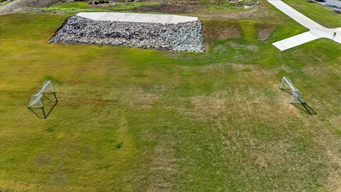 a view of a swimming pool with sitting area