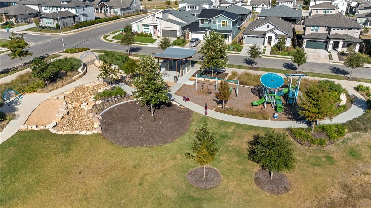 7701 Ellas Inlt Drive Austin, TX 78744 - Photo 27 of 27 a view of a swimming pool with sitting area