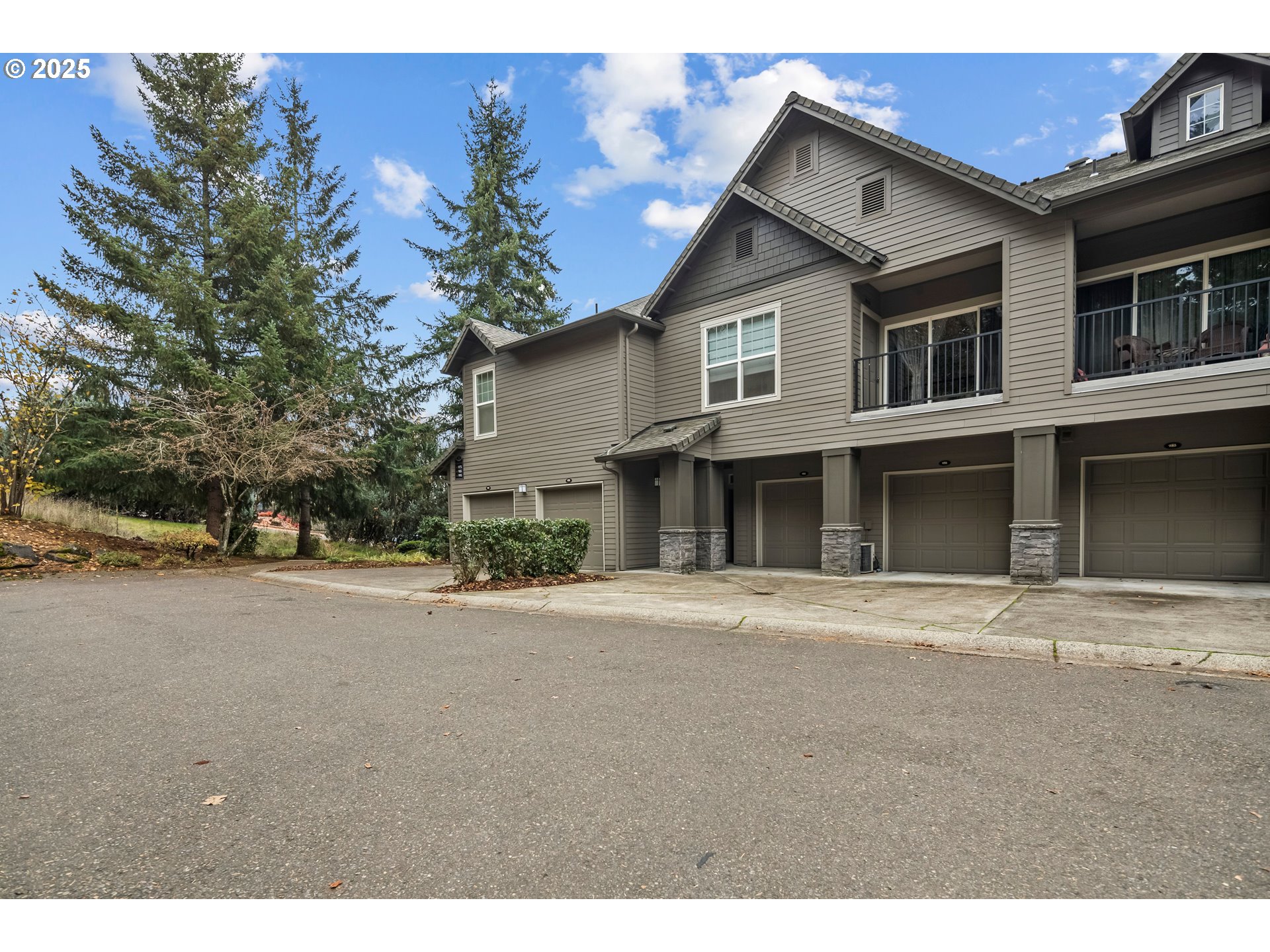 975 Springtree Lane West Linn, OR 97068 - Photo 1 of 48 a front view of a house with a yard and garage