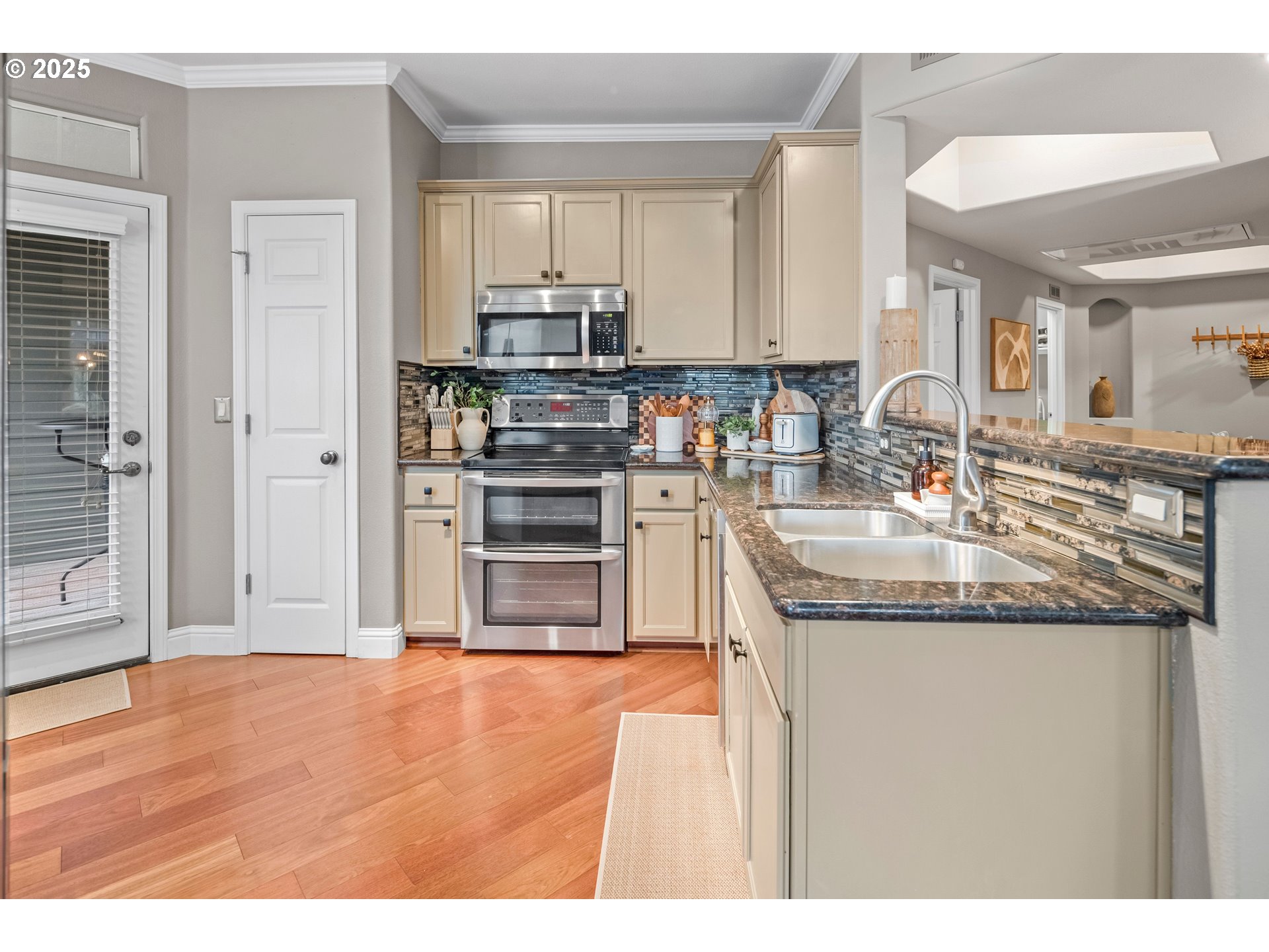 975 Springtree Lane West Linn, OR 97068 - Photo 17 of 48 a kitchen with stainless steel appliances granite countertop a sink and cabinets