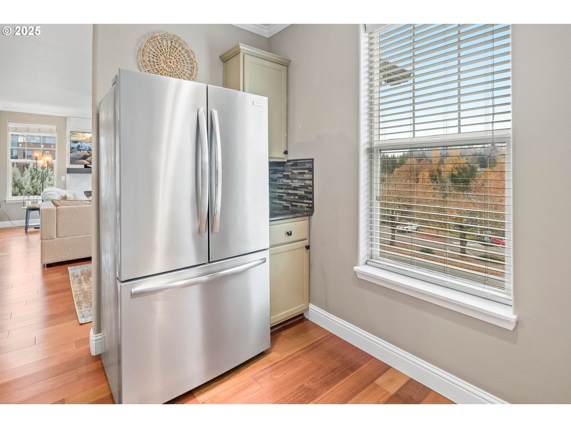 975 Springtree Lane West Linn, OR 97068 - Photo 19 of 48 a kitchen with stainless steel appliances a refrigerator and a wooden floor