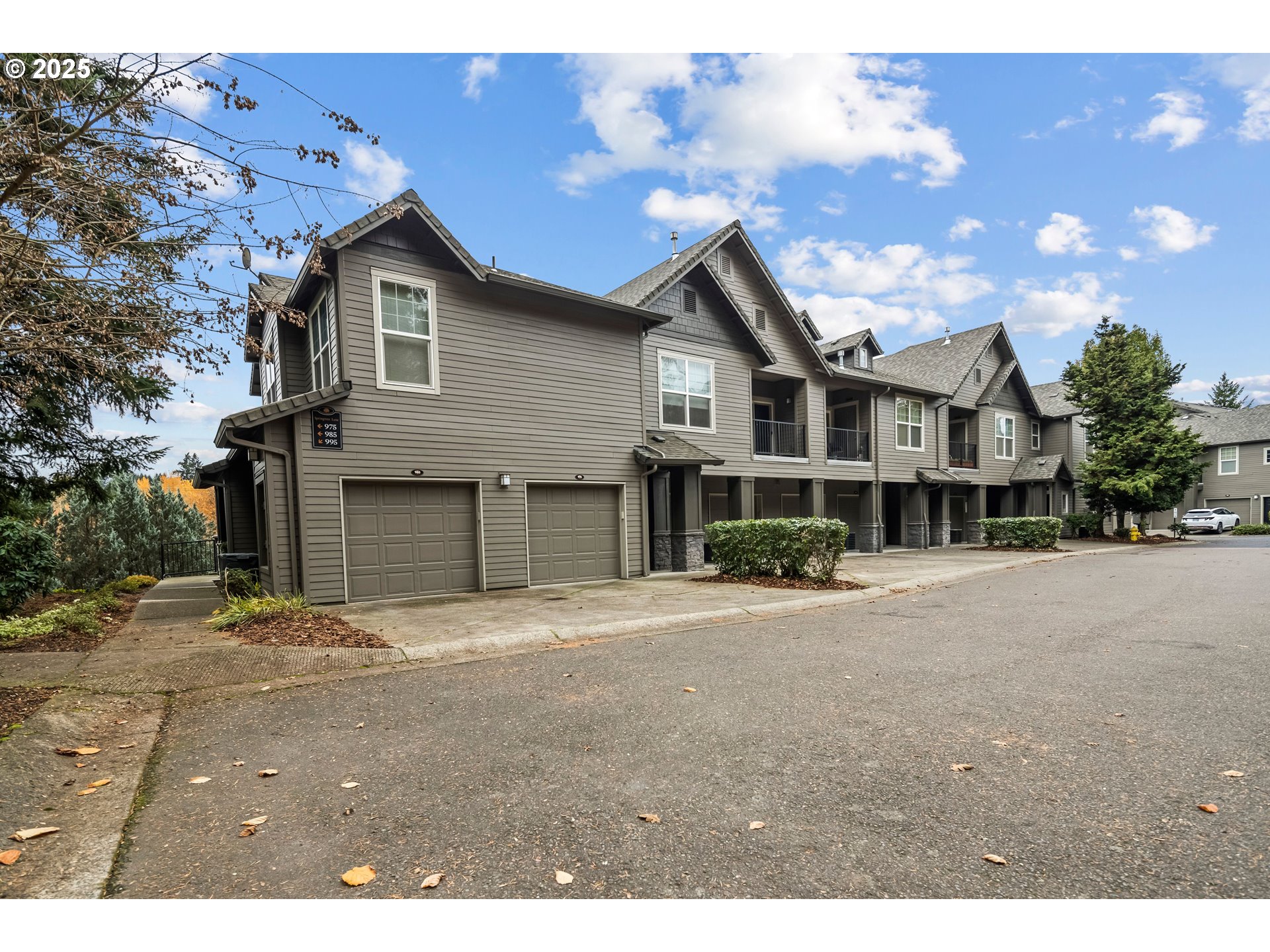 975 Springtree Lane West Linn, OR 97068 - Photo 2 of 48 a front view of a house with a yard and garage