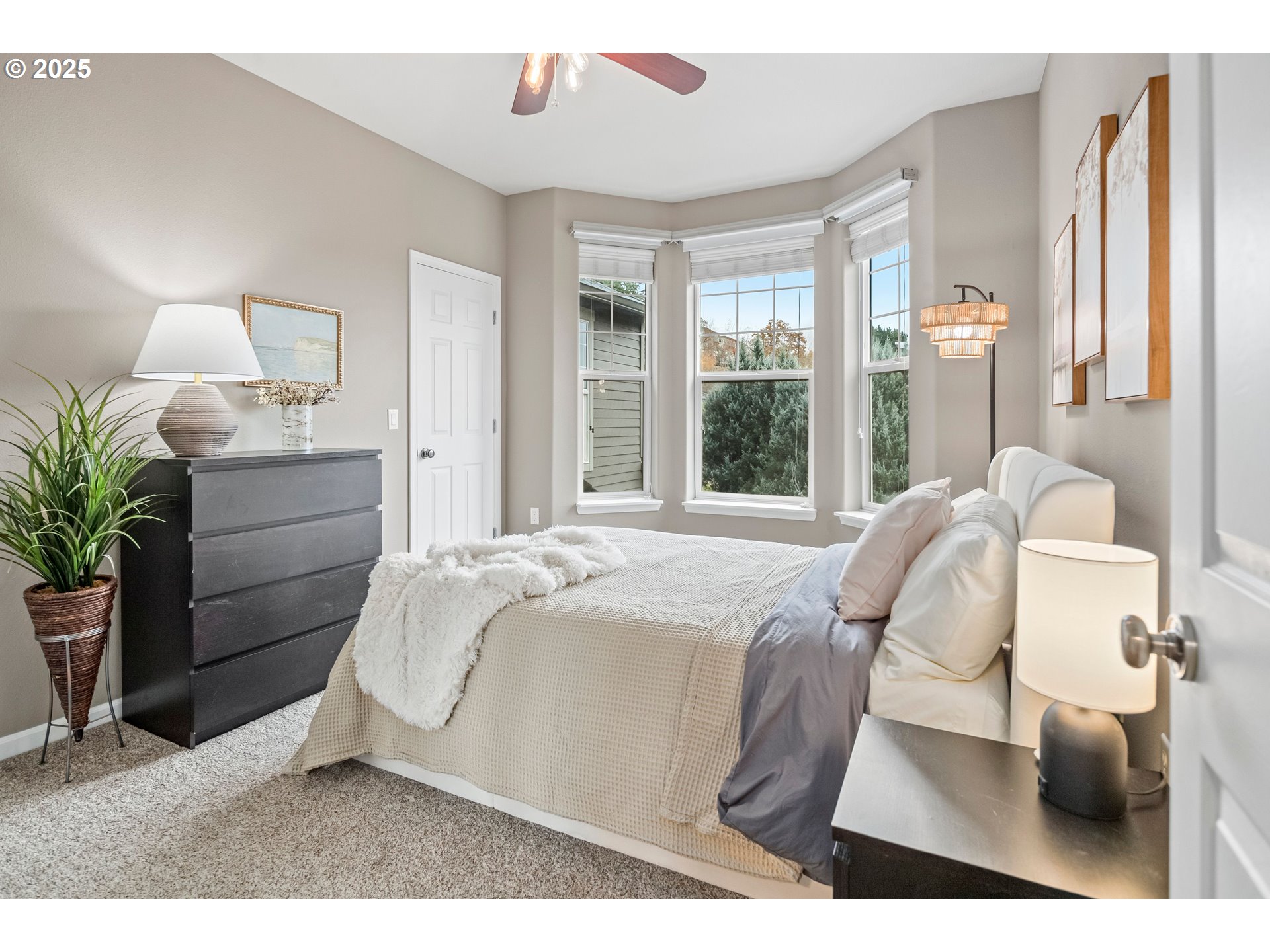 975 Springtree Lane West Linn, OR 97068 - Photo 31 of 48 a bedroom with a bed and large windows