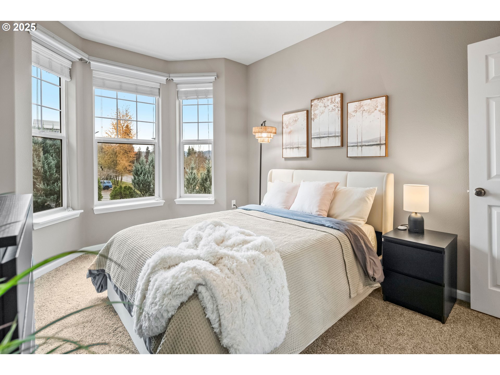 975 Springtree Lane West Linn, OR 97068 - Photo 32 of 48 a bedroom with a bed and a large window