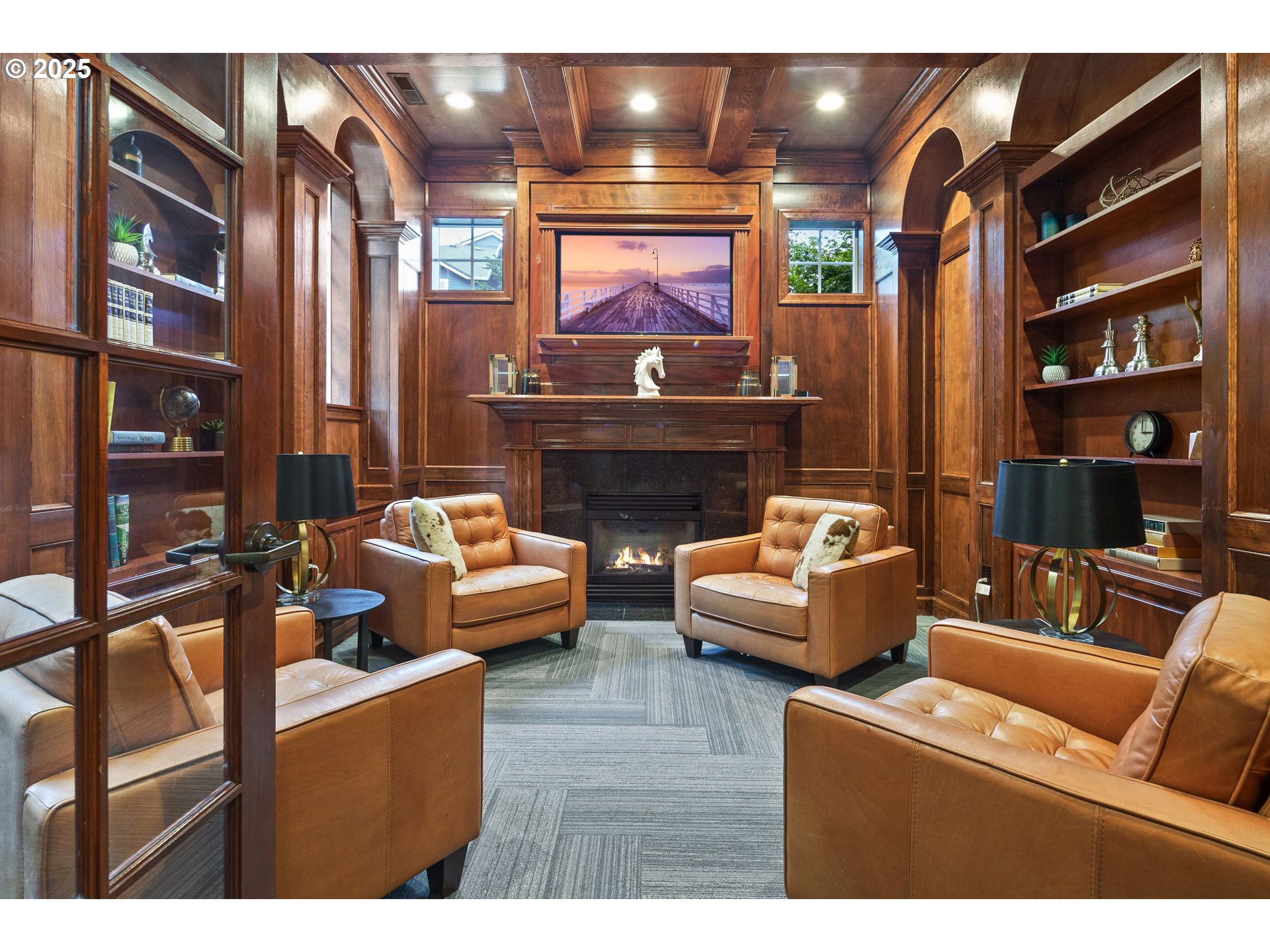 975 Springtree Lane West Linn, OR 97068 - Photo 42 of 48 a living room with furniture a bookshelf and a fireplace
