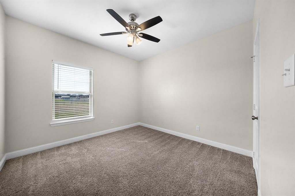 11729 County Road 313 Terrell, TX 75161 - Photo 18 of 25 an empty room with a window and a fan