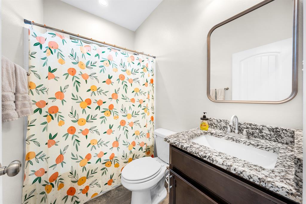 11729 County Road 313 Terrell, TX 75161 - Photo 19 of 25 a bathroom with a granite countertop sink and a mirror