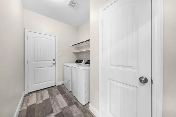 a view of a storage & utility room with closet