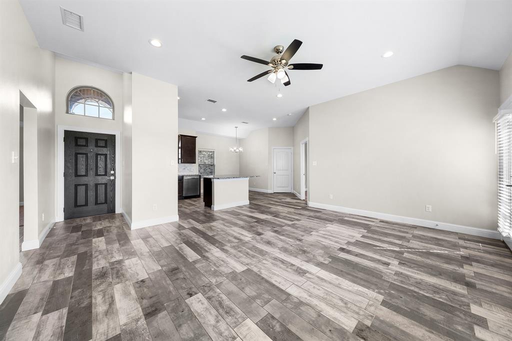 11729 County Road 313 Terrell, TX 75161 - Photo 8 of 25 a view of a livingroom with a ceiling fan and wooden floor