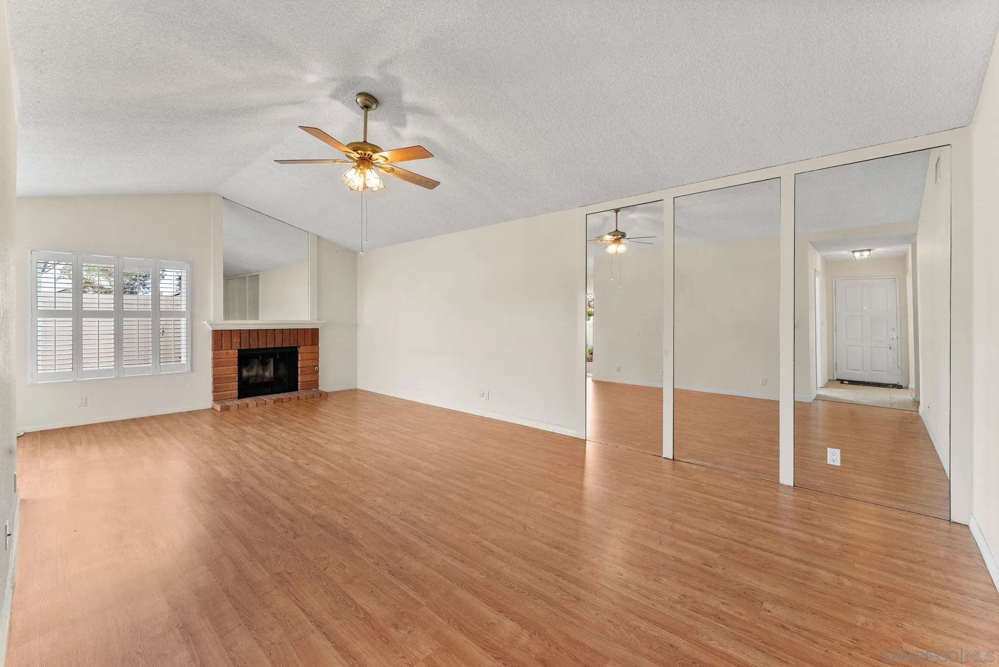 10357 Bart Way Santee, CA 92071 - Photo 14 of 39 a view of empty room with wooden floor and fan