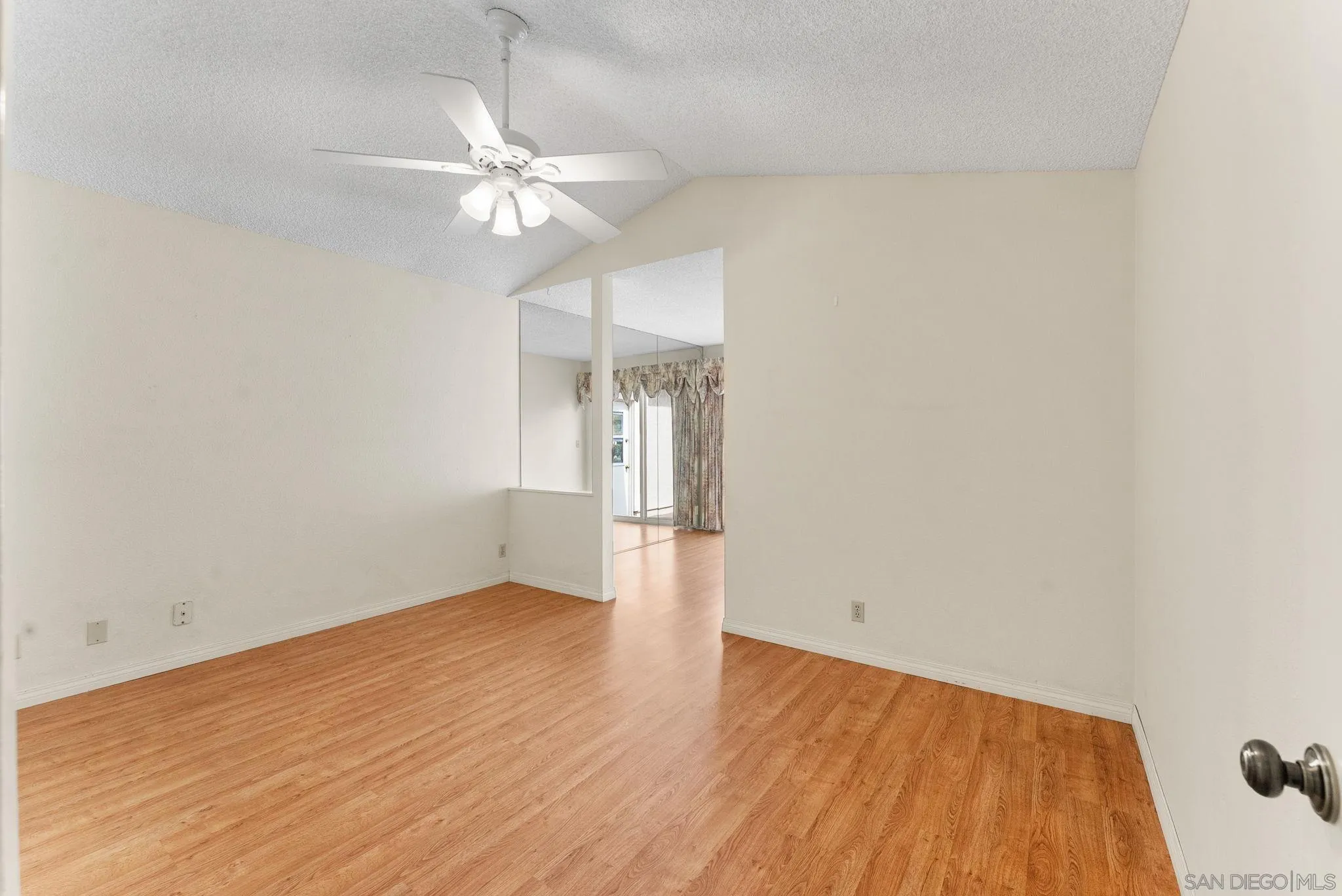 10357 Bart Way Santee, CA 92071 - Photo 15 of 39 an empty room with wooden floor and windows