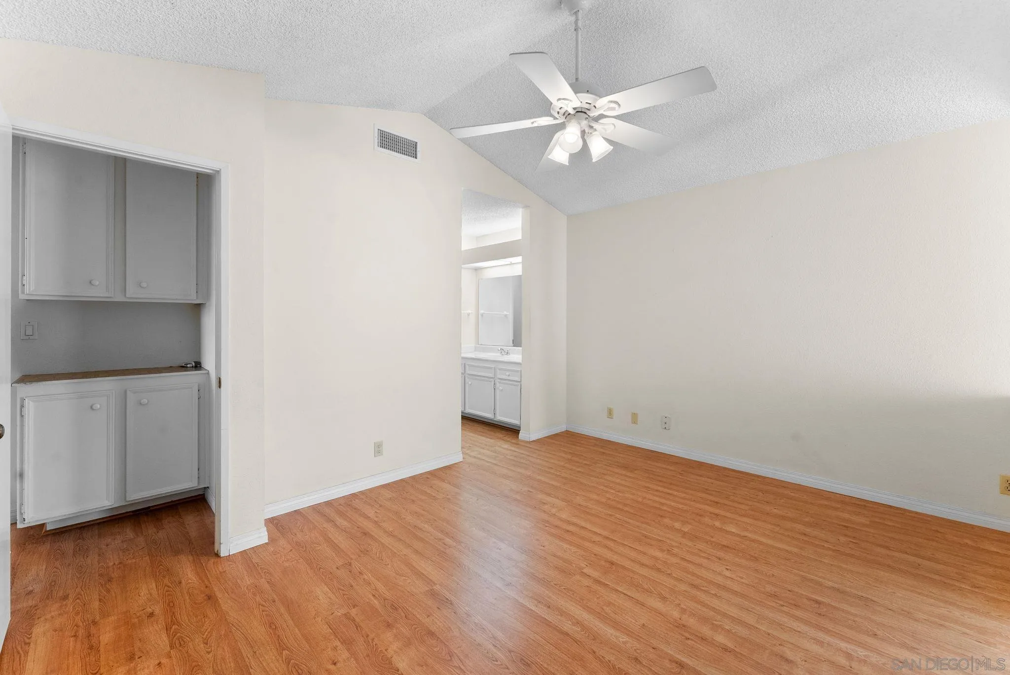 10357 Bart Way Santee, CA 92071 - Photo 16 of 39 an empty room with wooden floor and fan