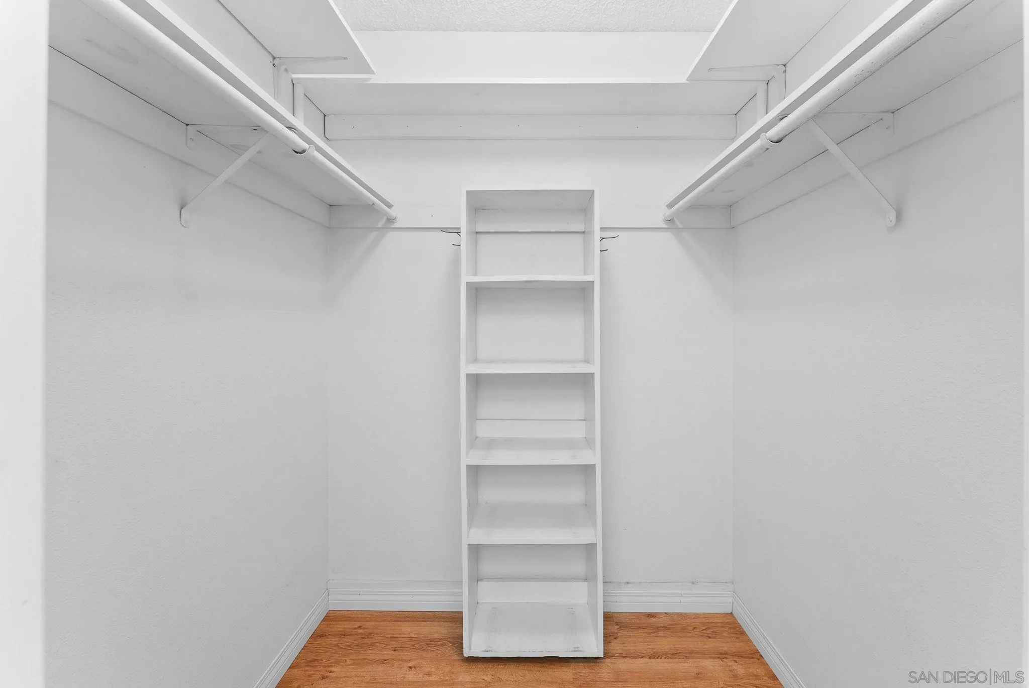 10357 Bart Way Santee, CA 92071 - Photo 24 of 39 a view of walk in closet with empty racks
