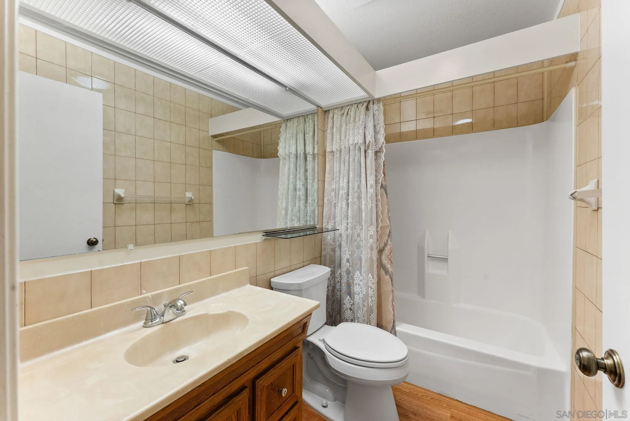 10357 Bart Way Santee, CA 92071 - Photo 26 of 39 a bathroom with a sink toilet and shower