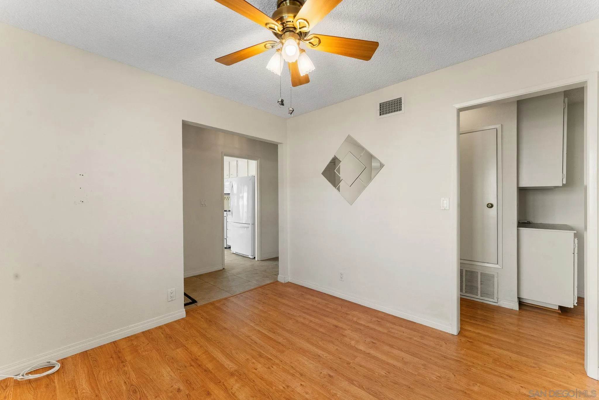 10357 Bart Way Santee, CA 92071 - Photo 27 of 39 a view of empty room with wooden floor and ceiling fan