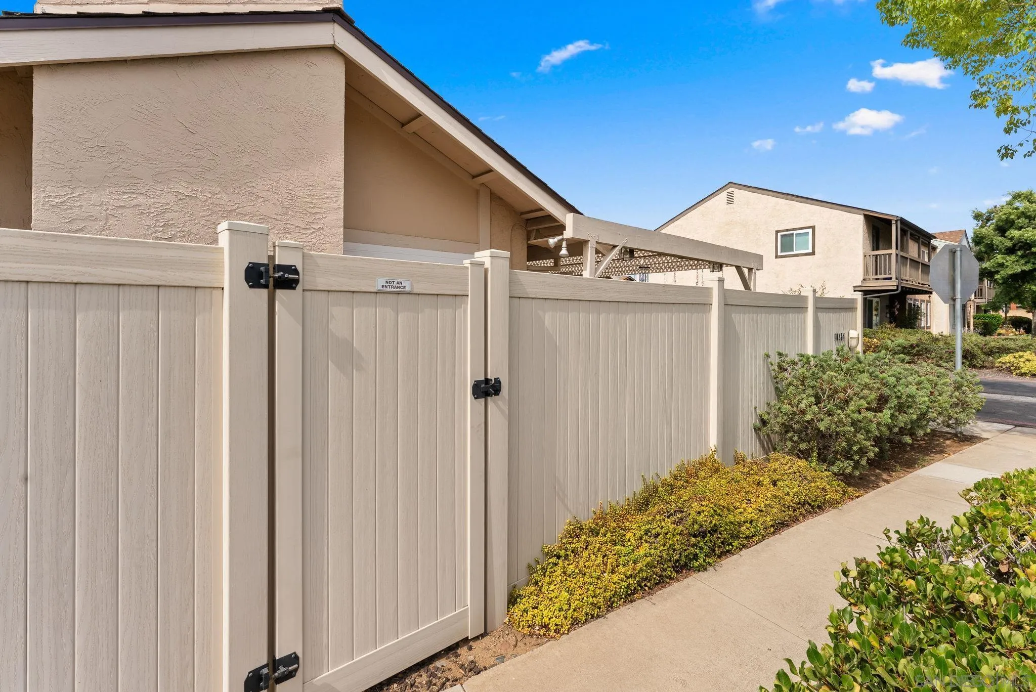10357 Bart Way Santee, CA 92071 - Photo 30 of 39 a view of a house with a backyard