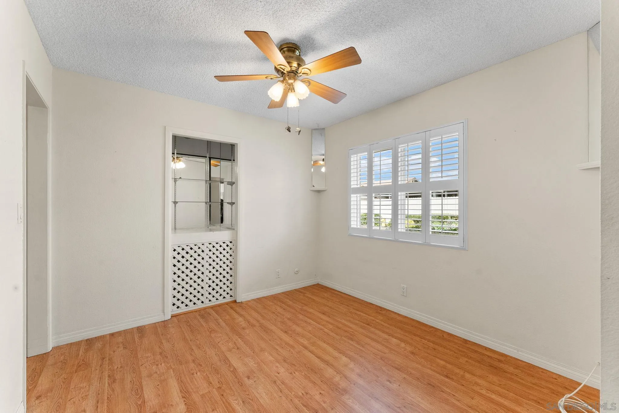 10357 Bart Way Santee, CA 92071 - Photo 3 of 39 a view of a livingroom with a ceiling fan and wooden floor