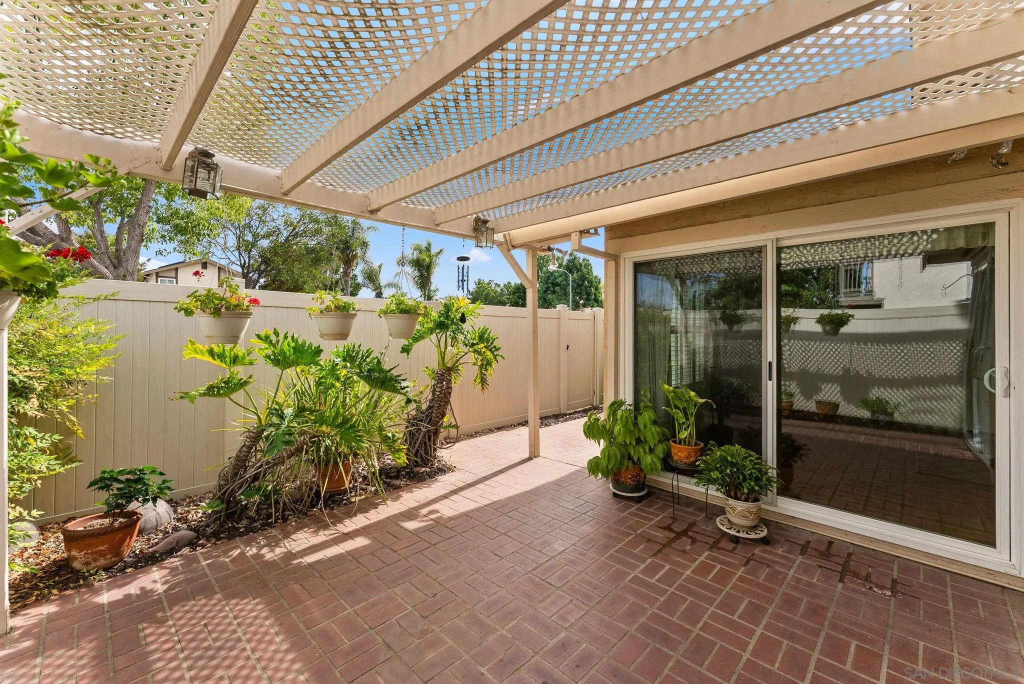 10357 Bart Way Santee, CA 92071 - Photo 9 of 39 a potted plant sitting in front of a house