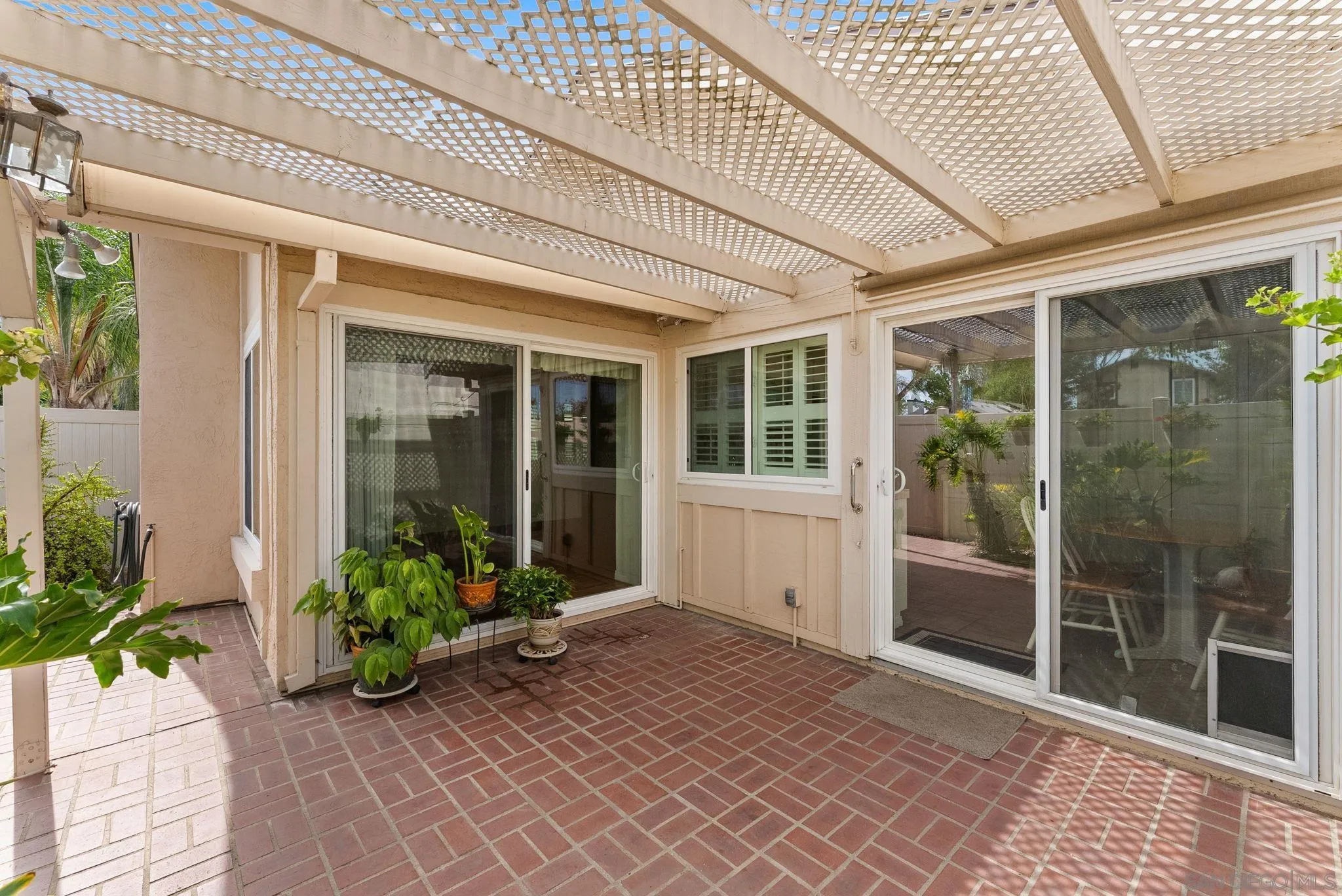 10357 Bart Way Santee, CA 92071 - Photo 10 of 39 a front view of a house with a glass door