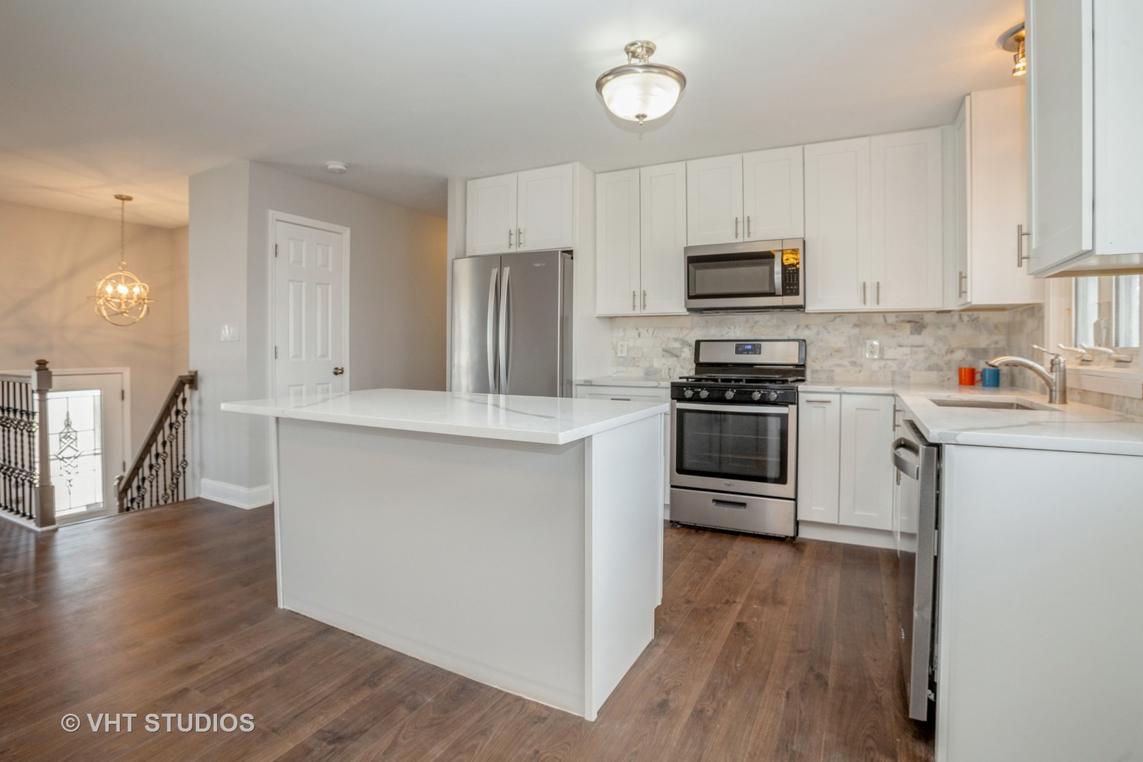 326 Brunswick Court Streamwood, IL 60107 - Photo 2 of 10 a kitchen with stainless steel appliances a refrigerator stove microwave and cabinets