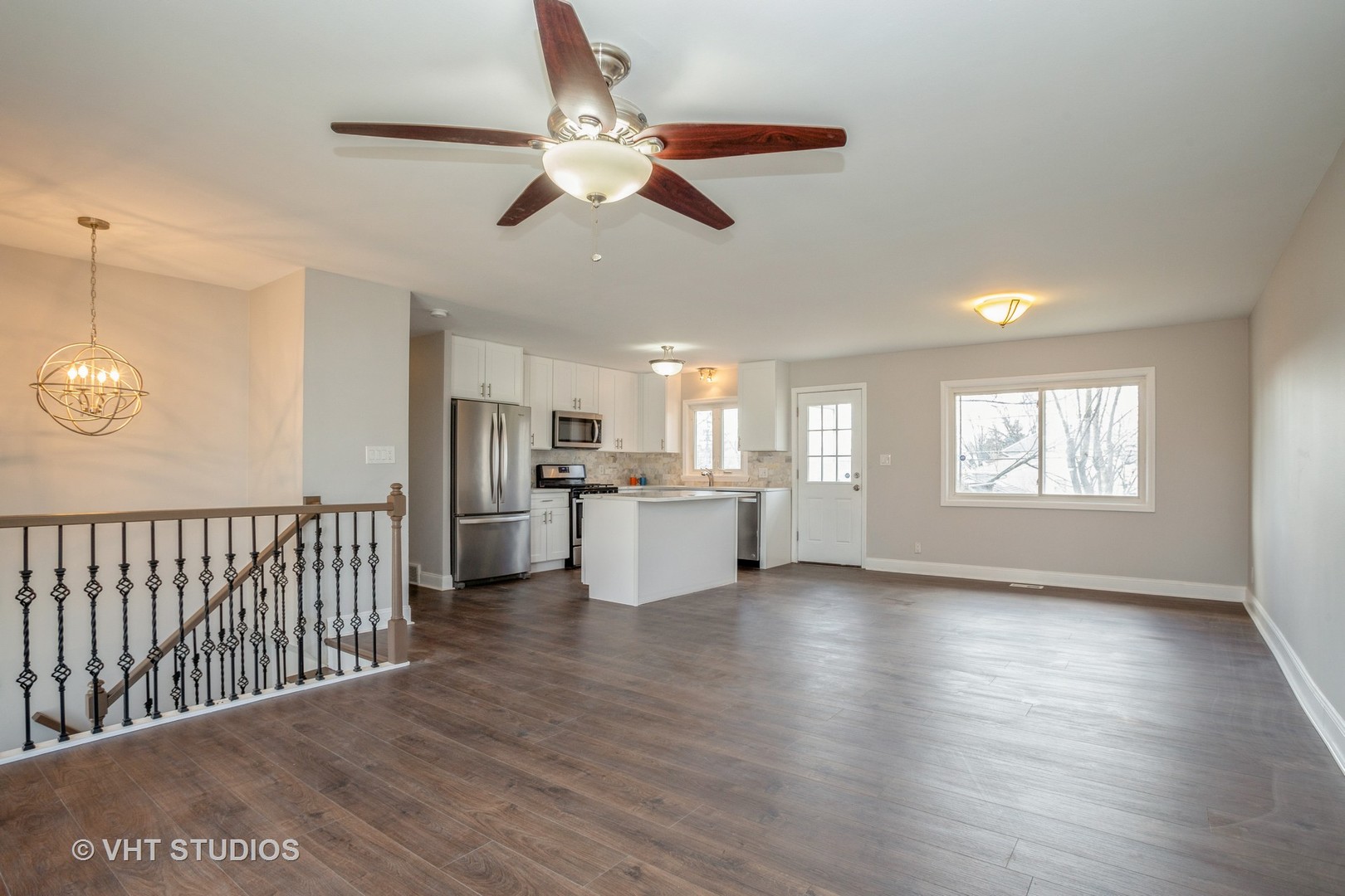 326 Brunswick Court Streamwood, IL 60107 - Photo 5 of 10 a view of a kitchen with wooden floor and a window