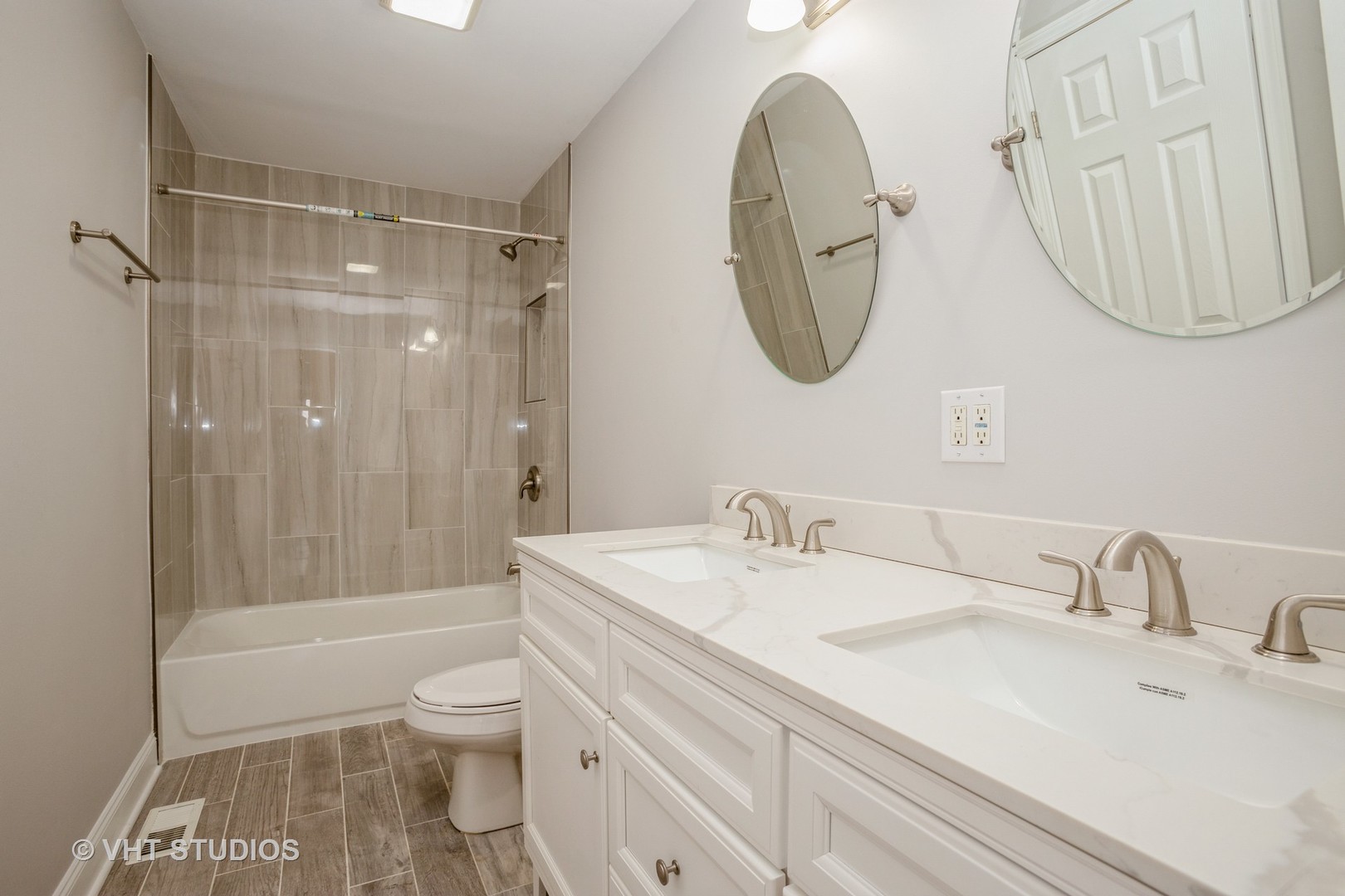 326 Brunswick Court Streamwood, IL 60107 - Photo 8 of 10 a bathroom with a sink toilet and shower