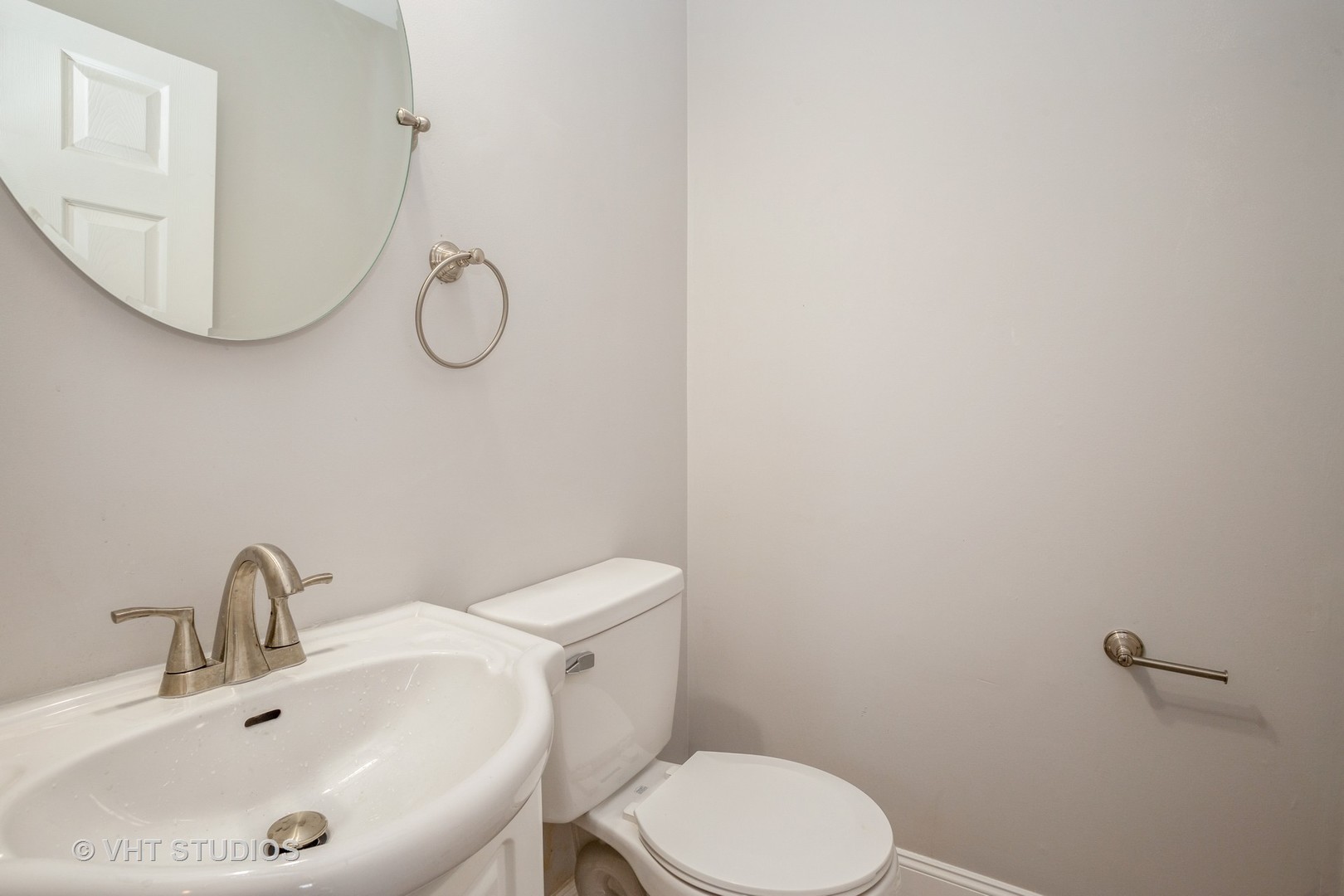 326 Brunswick Court Streamwood, IL 60107 - Photo 9 of 10 a bathroom with a sink mirror and toilet