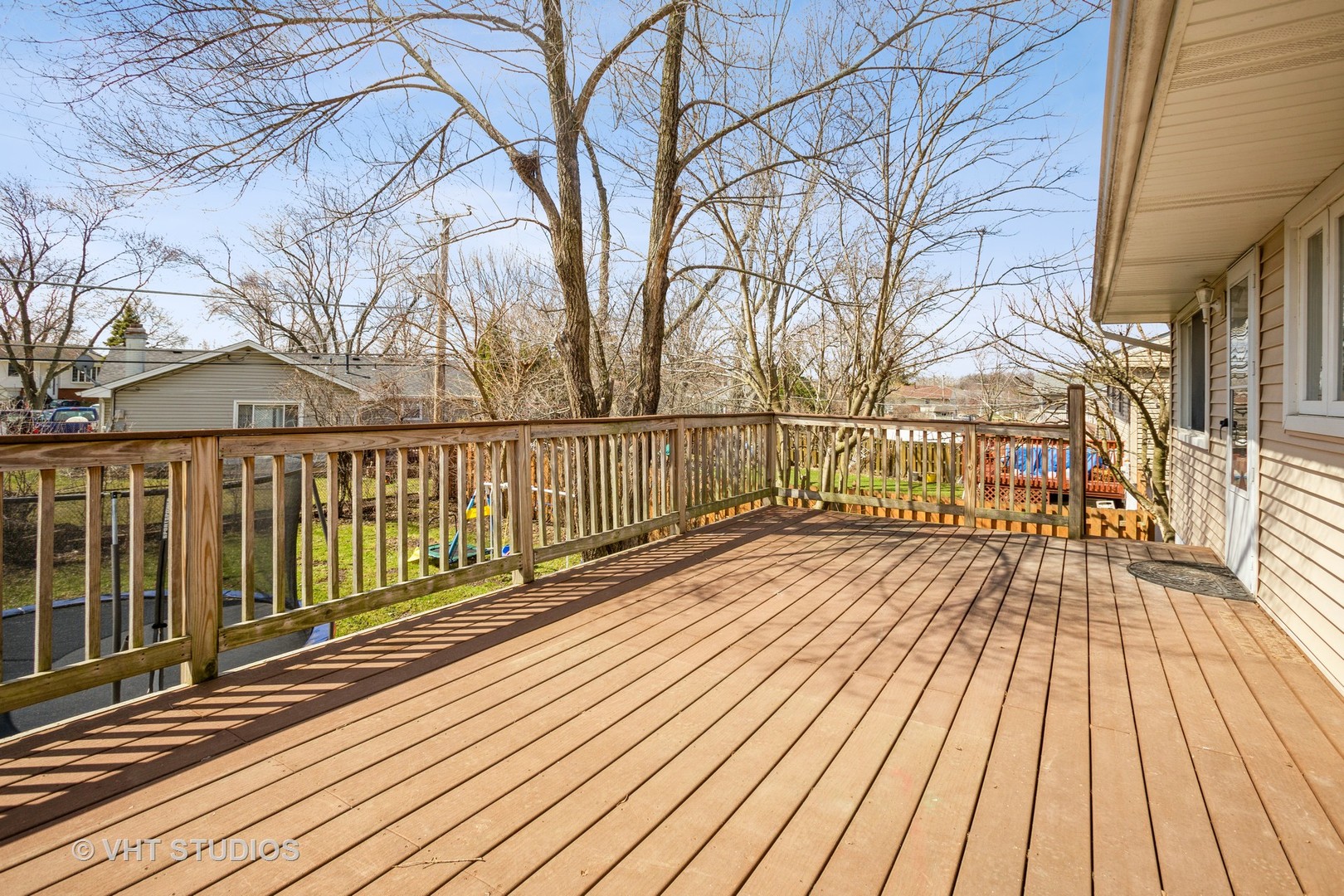 326 Brunswick Court Streamwood, IL 60107 - Photo 10 of 10 a view of wooden balcony with wooden floor and fence and a bench