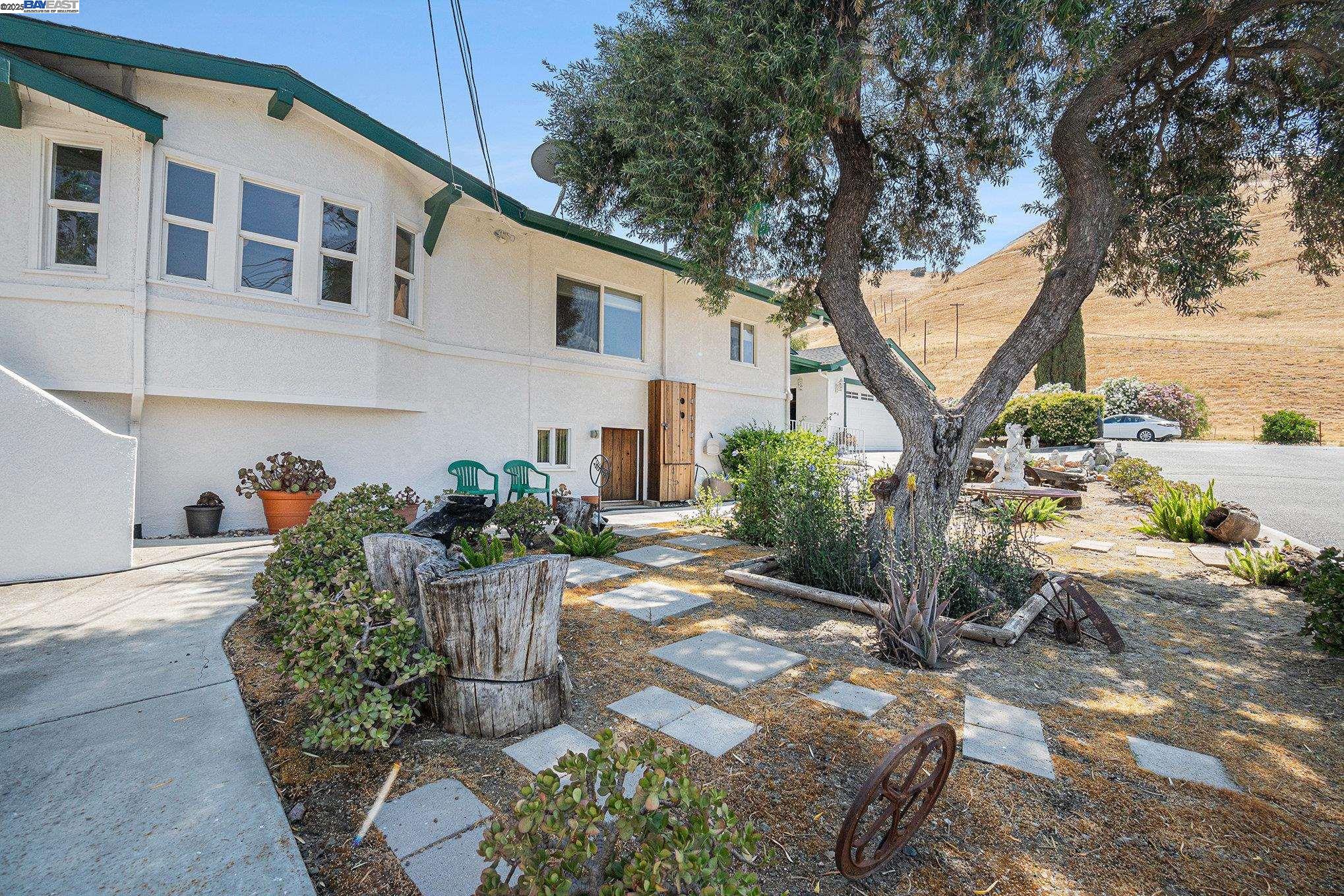 5799 Nortonville Road Pittsburg, CA 94565 - Photo 6 of 59 a front view of a house with garden