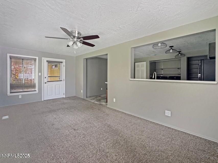 121 West Shepard Street Winnemucca, NV 89445 - Photo 11 of 14 a view of a livingroom with furniture and chandelier fan