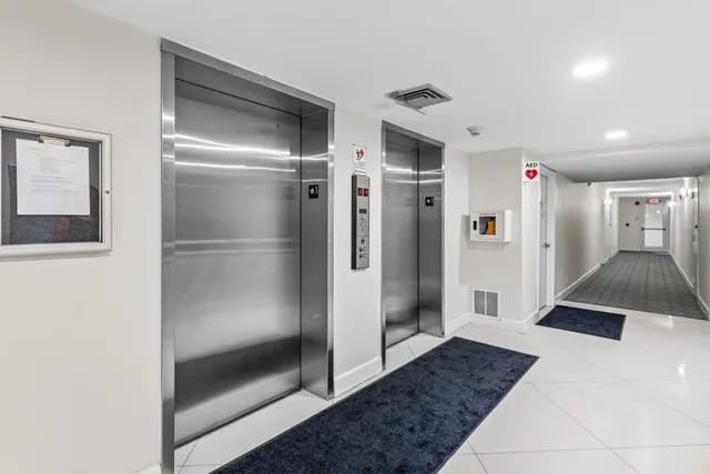 a bathroom with a shower and closet