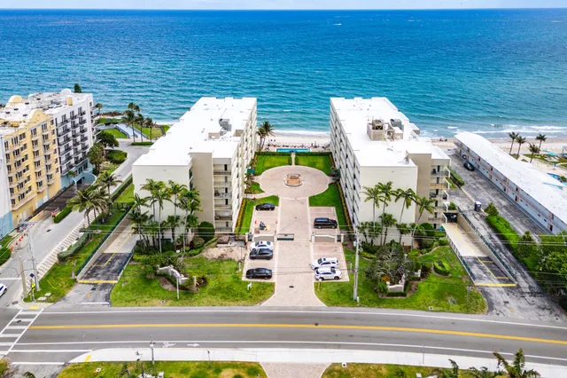 a terrace with outdoor seating and water view
