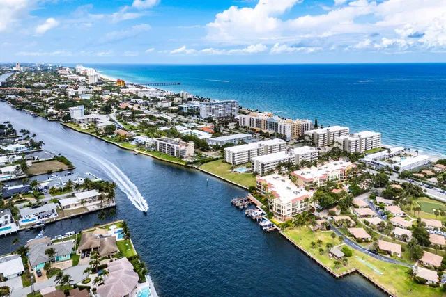 a view of a lake with tall buildings