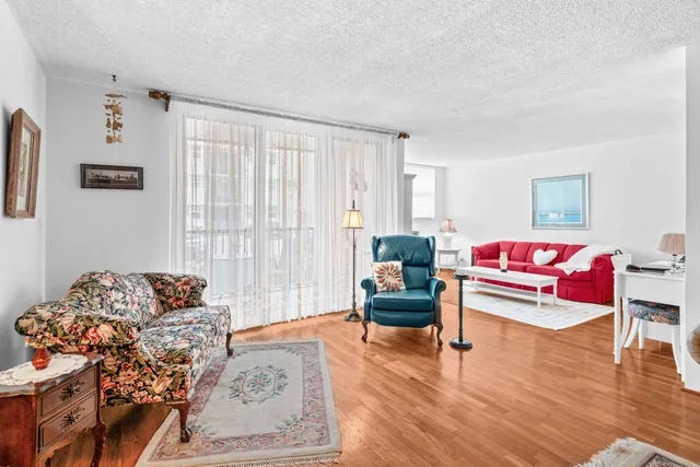 a bedroom with furniture and a wooden floor