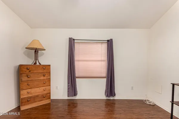 a view of room with wooden floor