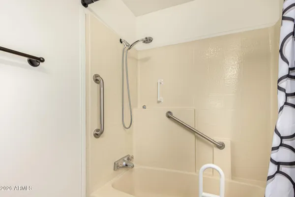 a bathroom with a shower and a bathtub