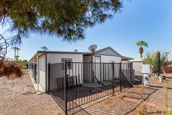 a view of a wrought iron fences in front of house
