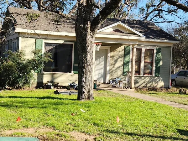 a view of a house with backyard porch and sitting area