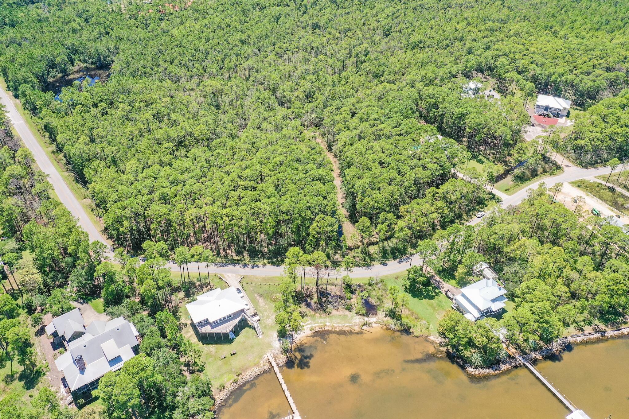 Lot 4 Whisper Lane Santa Rosa Beach, FL 32459 - Photo 9 of 16 an aerial view of residential house with outdoor space and trees all around