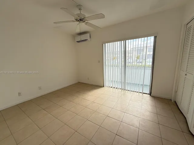 a view of an empty room and a window