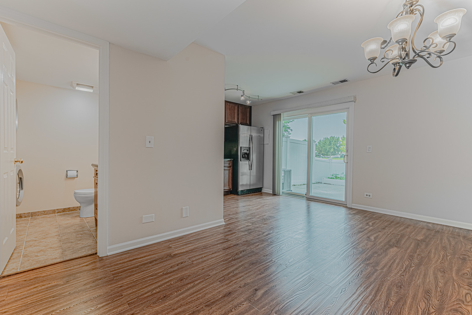 184 Rodenburg Road Roselle, IL 60172 - Photo 5 of 29 a view of an empty room with wooden floor