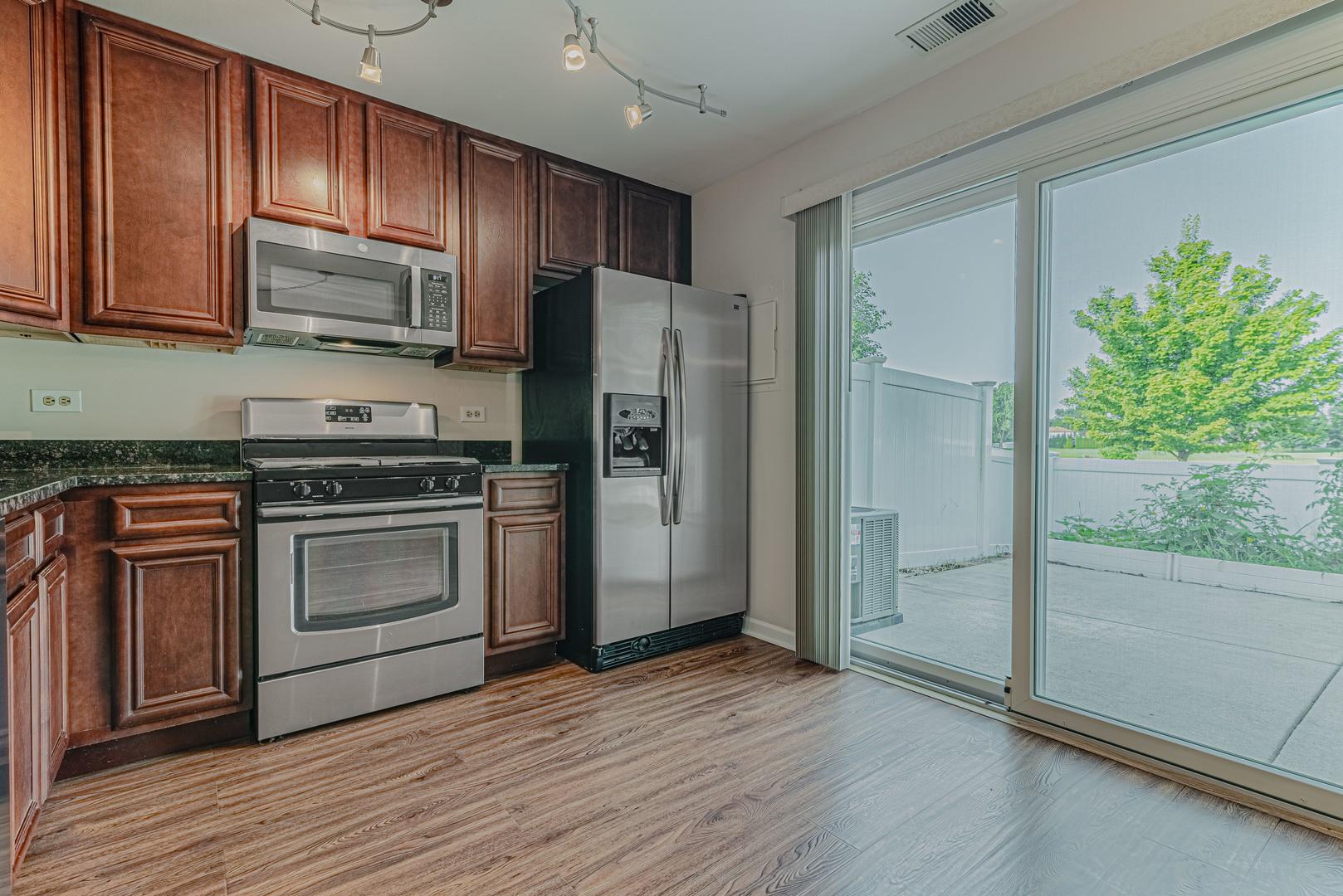 184 Rodenburg Road Roselle, IL 60172 - Photo 8 of 29 a kitchen with stainless steel appliances granite countertop a stove a refrigerator and a microwave oven