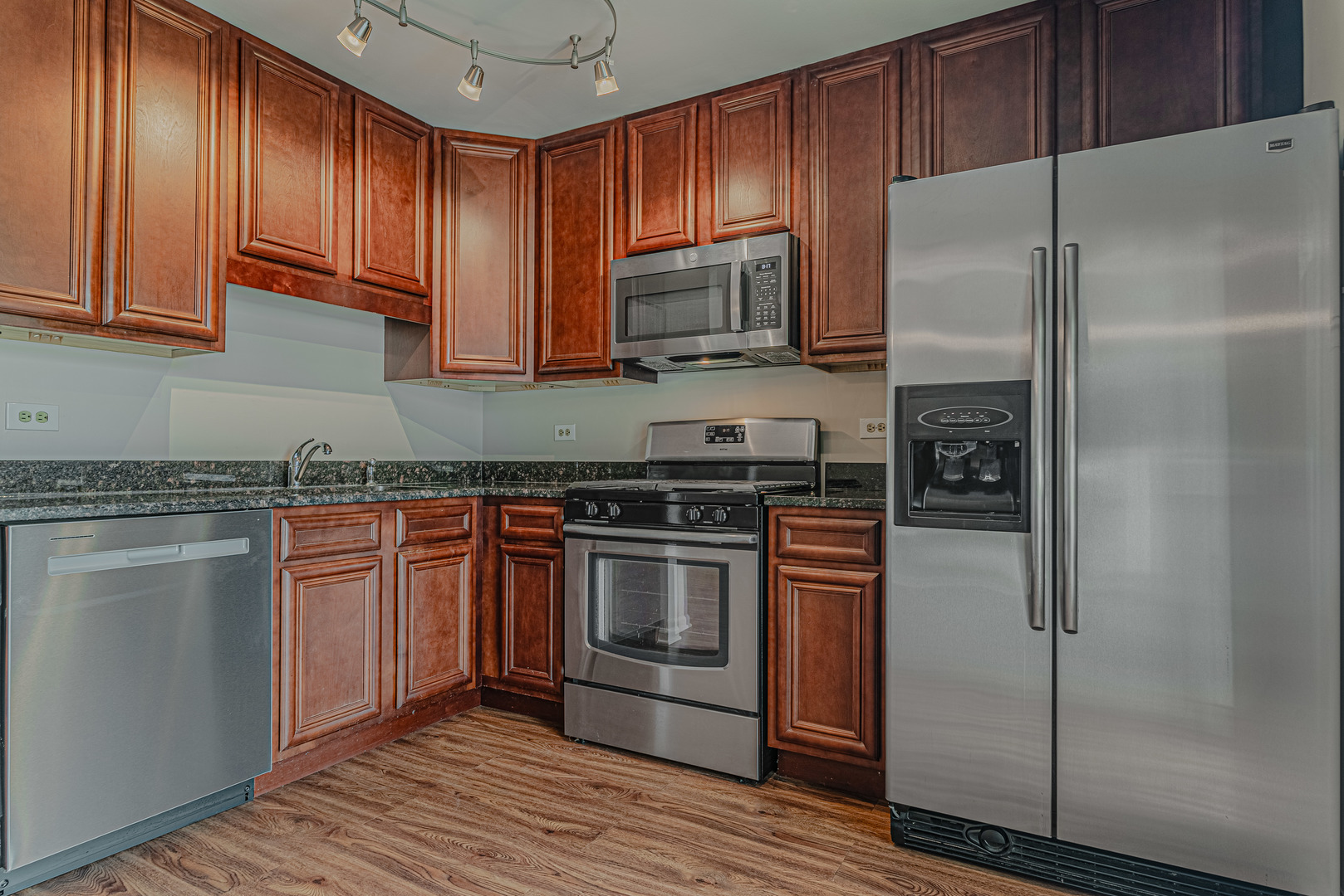 184 Rodenburg Road Roselle, IL 60172 - Photo 9 of 29 a kitchen with stainless steel appliances granite countertop a refrigerator stove and sink