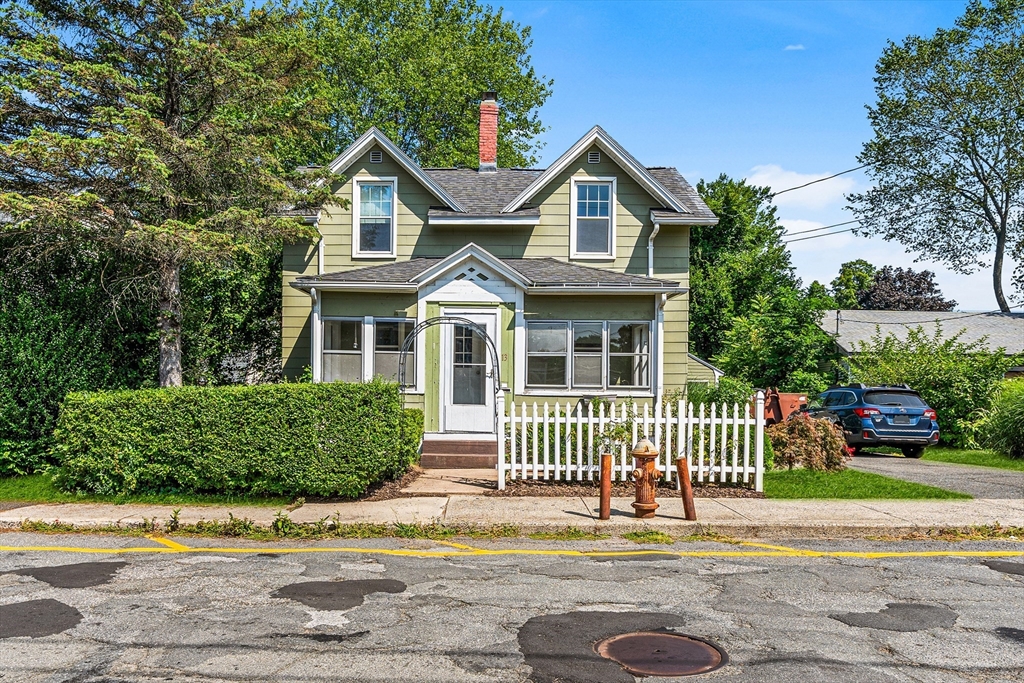 front view of a house with a garden