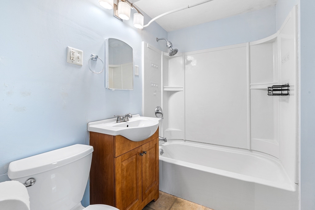 13 Maple Street Easthampton, MA 01027 - Photo 12 of 36 a bathroom with a sink toilet and shower