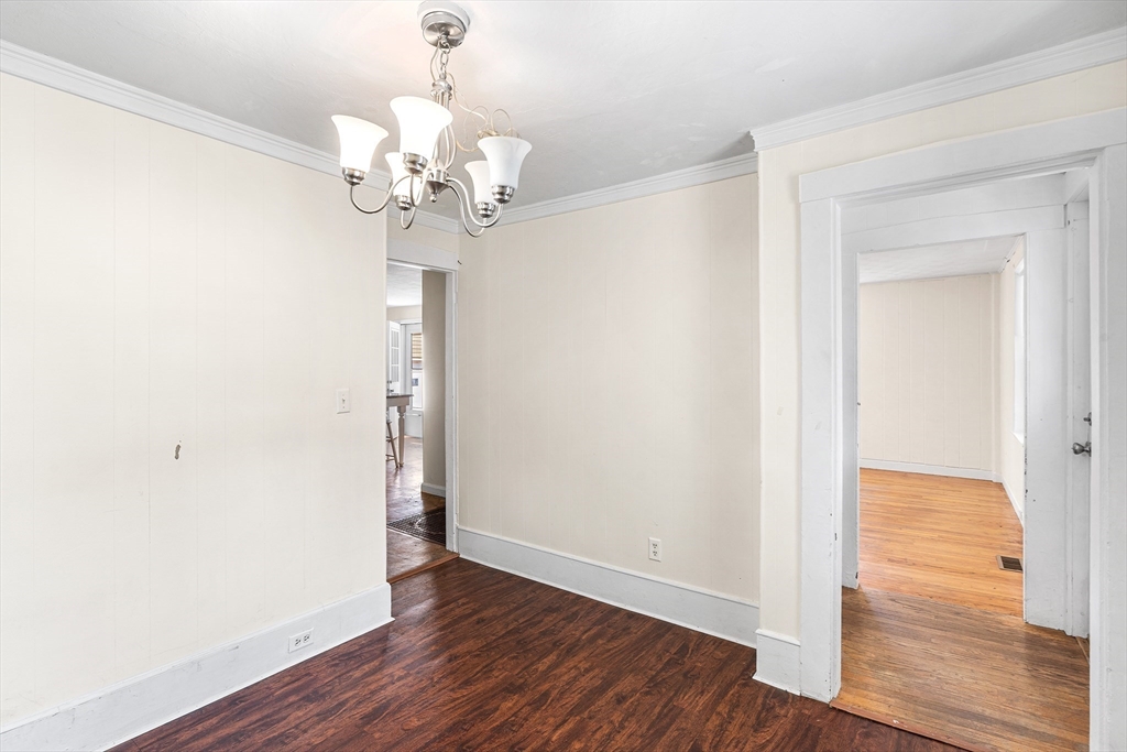 13 Maple Street Easthampton, MA 01027 - Photo 15 of 36 a view of a chandelier in a room with wooden floor